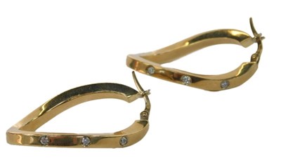 Lot 97 - A pair of oval hoop earrings, of twisted...