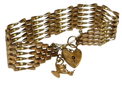 Lot 233 - A 9ct gold gate bracelet, with a heart-shaped...