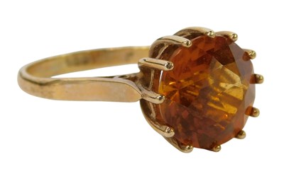 Lot 235 - A citrine dress ring, high claw set, yellow...