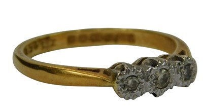Lot 237 - An 18ct gold and diamond three stone...