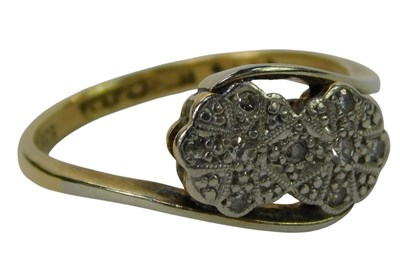 Lot 238 - A diamond ring, the tiny diamonds in a flower...