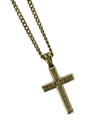 Lot 246 - A diamond cross pendant, in a yellow metal...