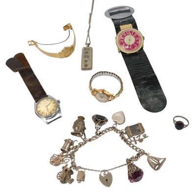 Lot 257 - A silver curb link charm bracelet, with a...