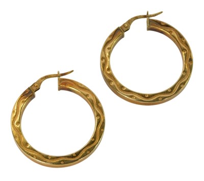 Lot 261 - A pair of hoop earrings, with dot and wave...