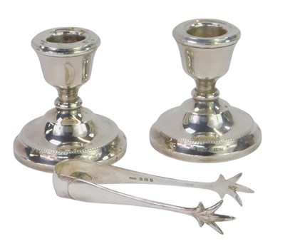 Lot 270 - A pair of Elizabeth II squat candlesticks,...