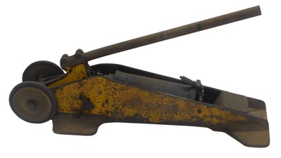 Lot 83 - A Dunlop trolley compressor jack.
