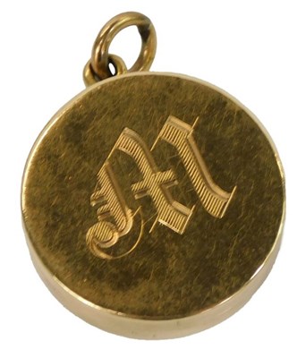 Lot 404 - A Victorian locket, of circular form, engraved...
