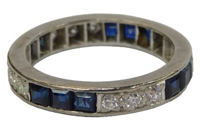 Lot 406 - A diamond and sapphire full eternity ring, the...