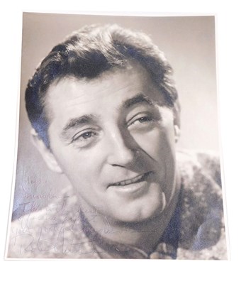 Lot 370 - A Robert Mitchum signed photograph, dedicated...