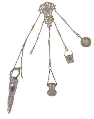 Lot 272 - A Victorian silver chatelaine, decorated with...