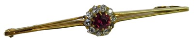 Lot 419 - A ruby and diamond circular set cluster bar...