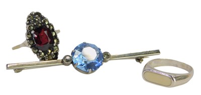 Lot 423 - A group of jewellery, comprising a red paste...