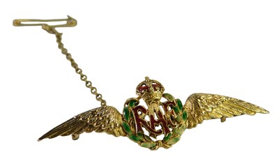 Lot 424 - An enamel RAF wings brooch, yellow metal...