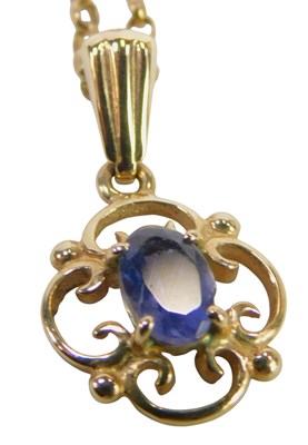 Lot 449 - A 9ct gold and tanzanite pendant, the oval...