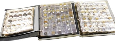 Lot 518 - Three albums of mixed world coinage, including...