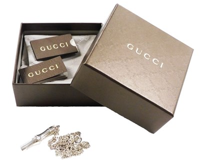 Lot 220 - A Gucci silver pendant, on a circular link...