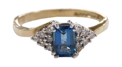 Lot 563 - A 9ct gold topaz and diamond ring, the...