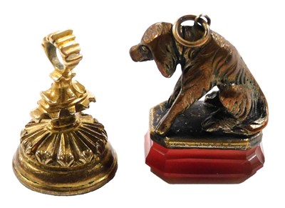 Lot 570 - A 19thC carnelian seal, the mount cast as a...