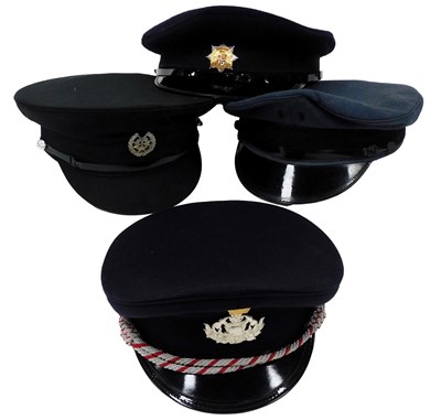 Lot 542 - A German Bundesrepublik fireman's peaked cap,...