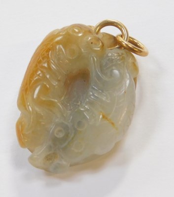 Lot 469 - A jade pendant formed as two intertwined carp,...
