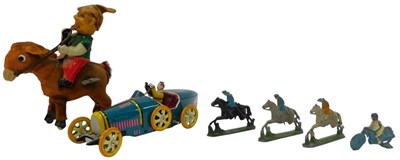 Lot 132 - A group of toys, comprising a tinplate wind up...
