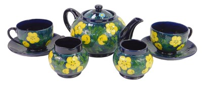 Lot 144 - A Moorcroft pottery Buttercup pattern tea...