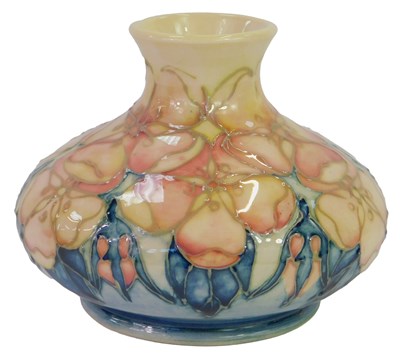 Lot 165 - A Moorcroft pottery Tudor Rose pattern vase...