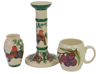 Lot 166 - A group of Moorcroft Plum pattern pottery,...