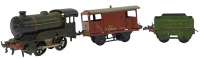 Lot 183 - A tinplate clockwork locomotive, in green...