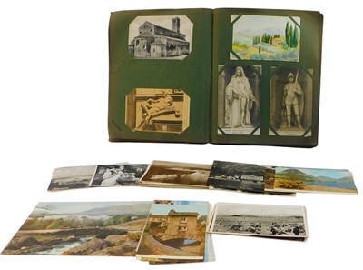 Lot 275 - An early 20thC postcard album, containing...
