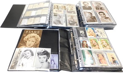 Lot 635 - Three albums of John Wayne related postcards,...