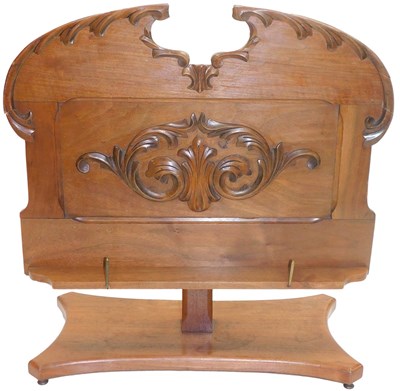 Lot 586 - An early 20th-century walnut music stand with...