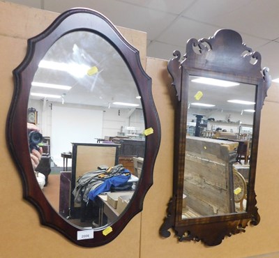 Lot 2006 - A fretwork mirror, 62cm high, 36cm wide, and...