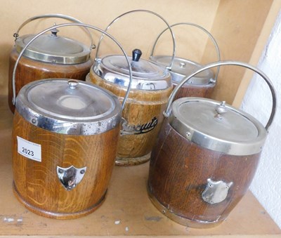 Lot 2023 - Five oak biscuit barrels, each with metal mounts.