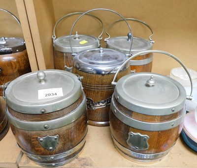 Lot 2034 - Five oak biscuit barrels, with metal mounts.