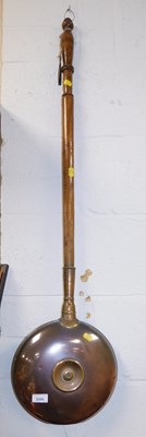 Lot 2090 - A copper warming pan, with a turned oak handle.