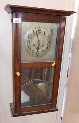 Lot 2091 - An oak cased wall clock, the dial bearing...
