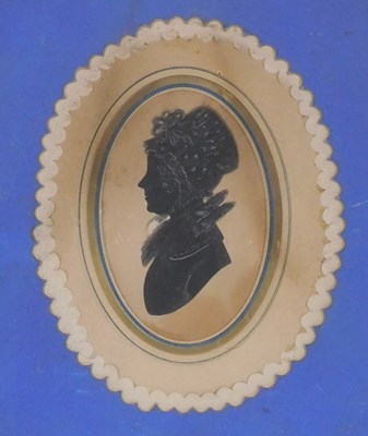 Lot 652 - An early 19thC silhouette portrait of a lady,...