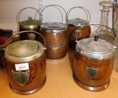 Lot 2111 - Five oak biscuit barrels, each with metal mounts.