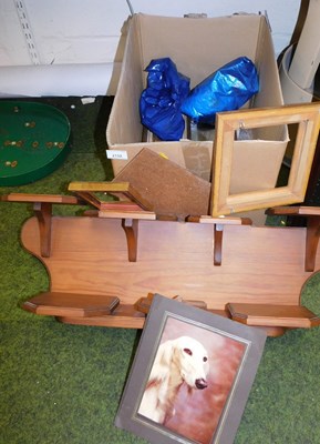 Lot 2132 - An oak two tier wall mounted shelf, together...