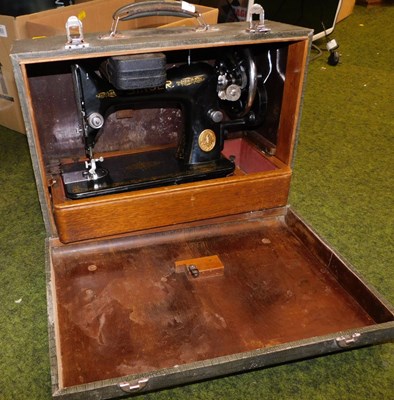 Lot 2141 - A cased Singer sewing machine, number EB412923.