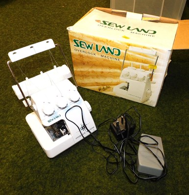 Lot 2147 - A Sewland over lock machine, boxed.
