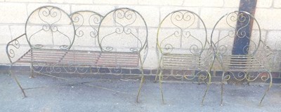 Lot 666 - A cast and wrought iron three seater garden...