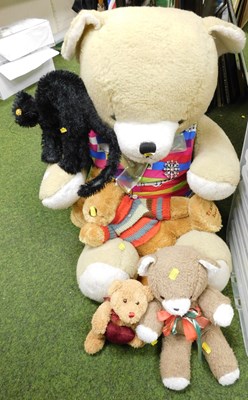 Lot 2196 - Soft toys, to include a large bear, black cat,...