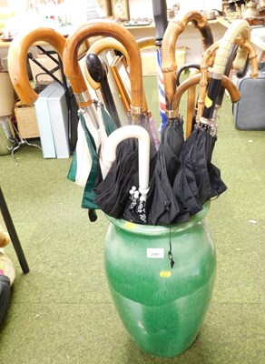 Lot 2197 - A pottery green glaze floor standing vase,...