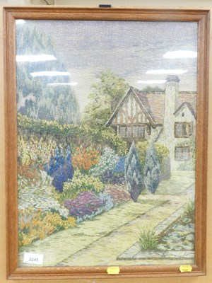 Lot 2245 - A woolwork embroidery, depicting a country...