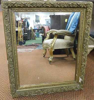 Lot 2277 - A gilt wood wall mirror, decorated with...