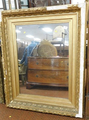 Lot 2279 - A gilt wood and gesso wall mirror, decorated...