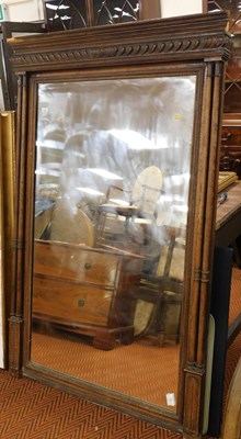 Lot 2281 - An oak framed overmantel mirror, the top with...