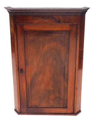 Lot 732 - A George III mahogany hanging corner cupboard,...